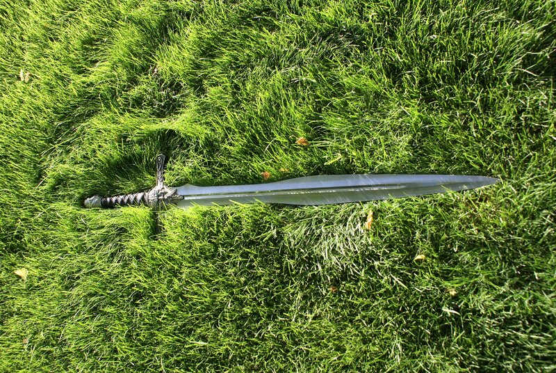 sword on green grass