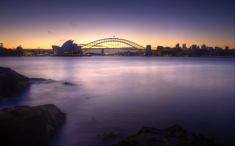 Sydney at dusk with Opera House and Harbour Bridge