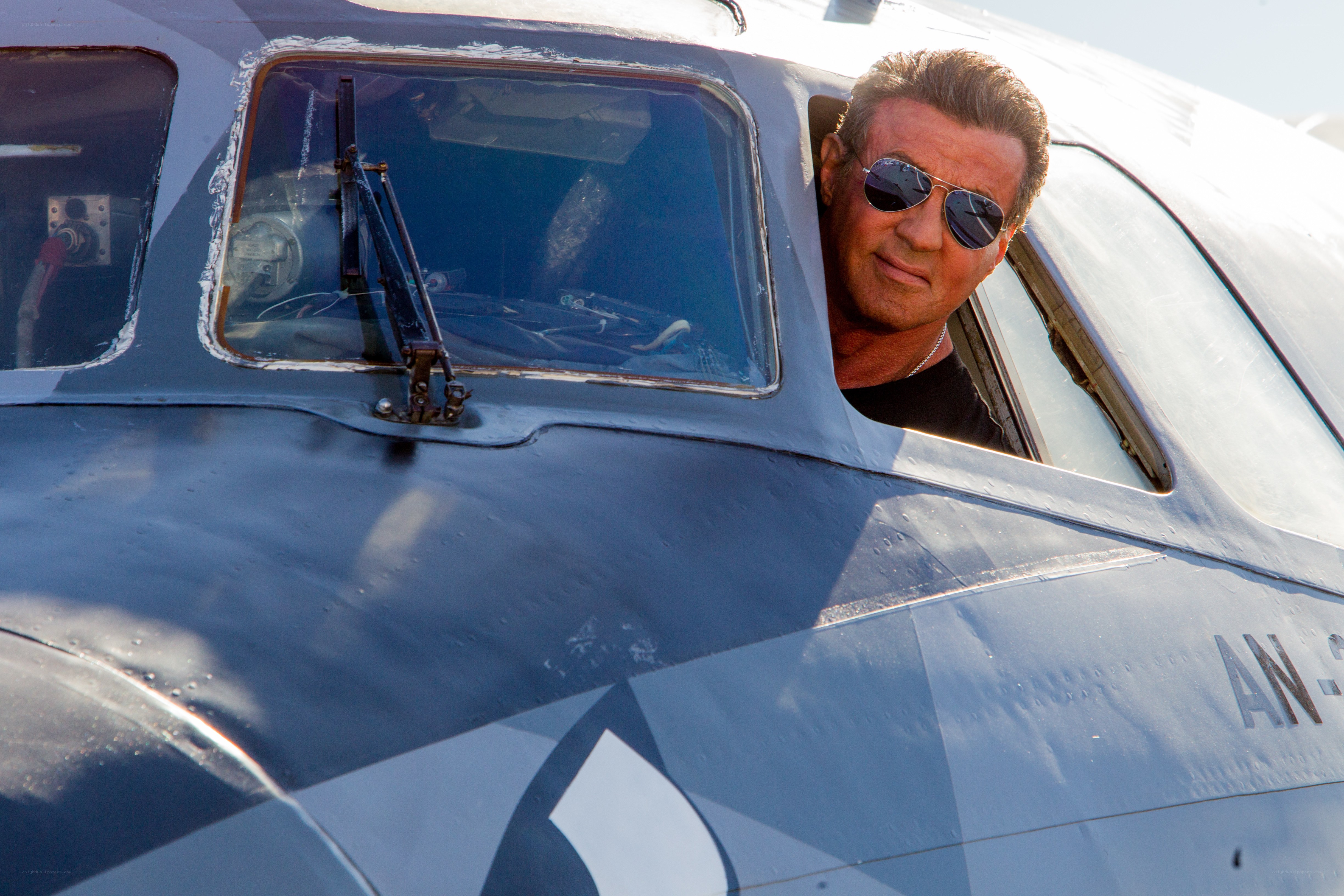 Sylvester Stallone in airplane cockpit