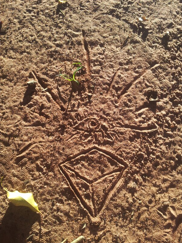 symbol drawn in the sand