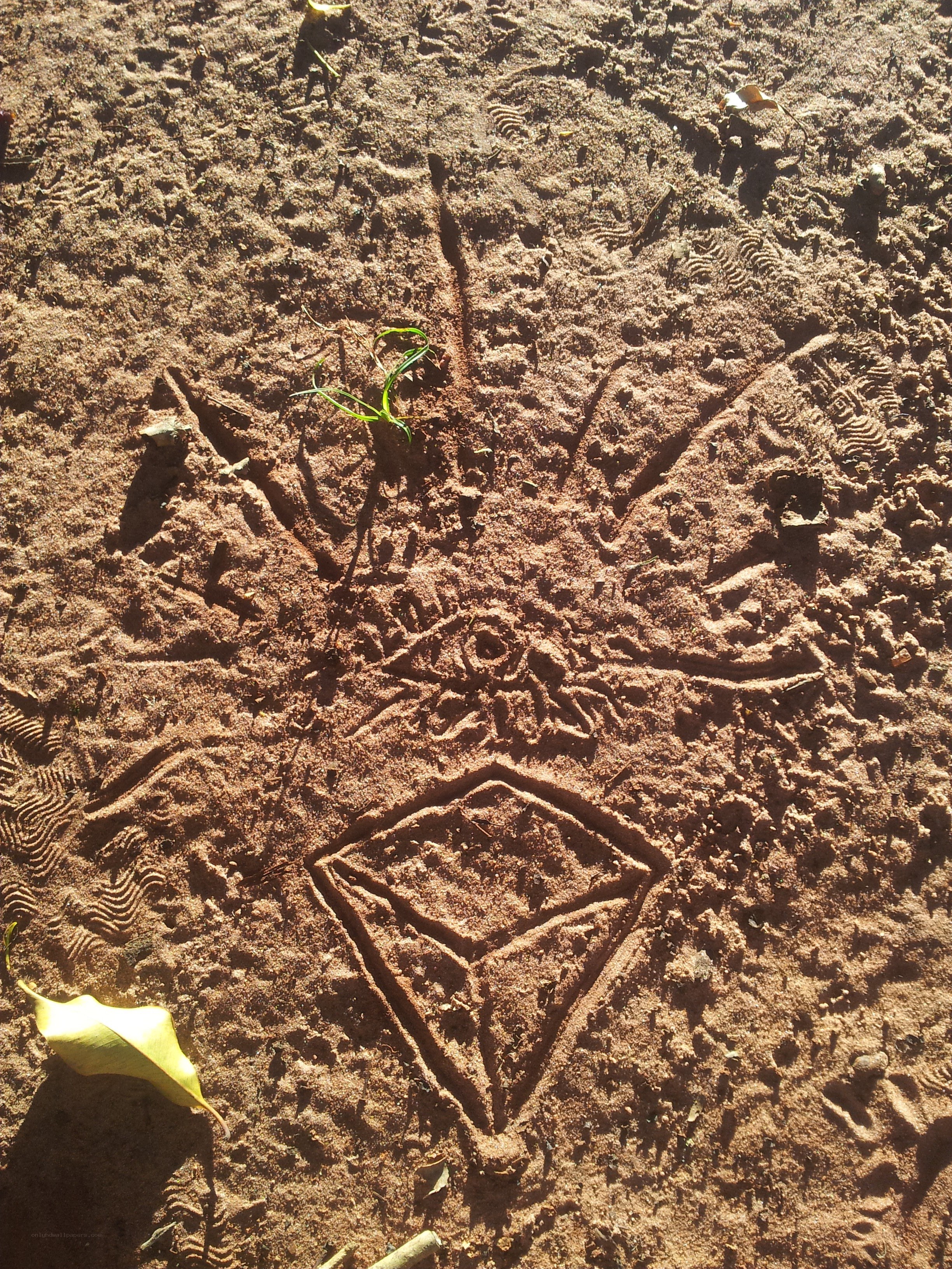 symbol drawn in the sand