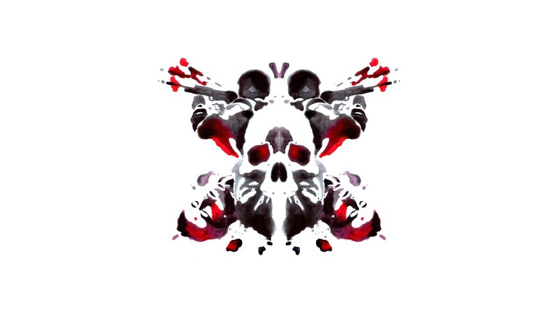 symmetrical inkblot with red and black