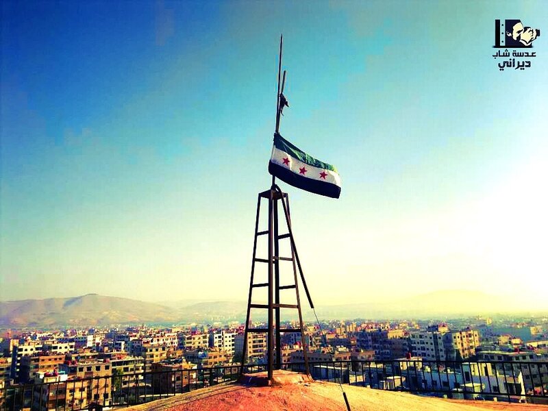 Syrian flag on a rooftop