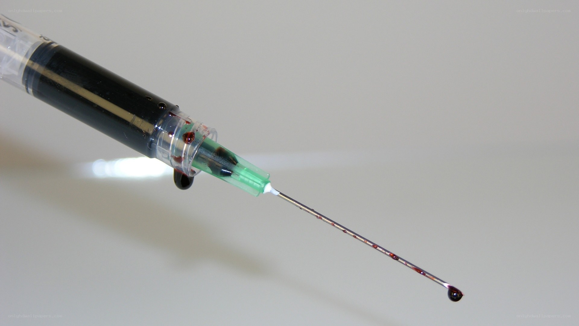 syringe with blood drop