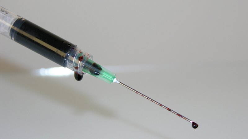 syringe with blood drop