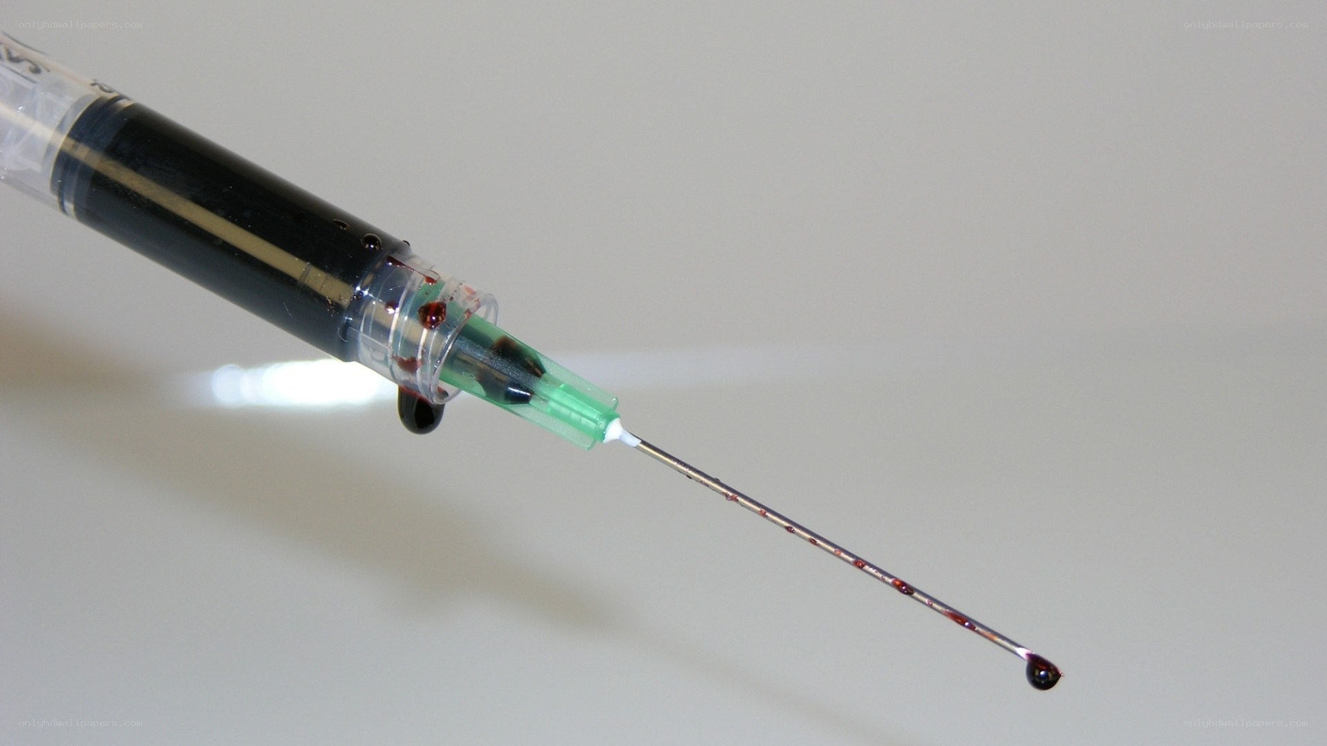 syringe with blood drop
