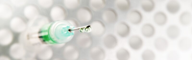 syringe with green liquid