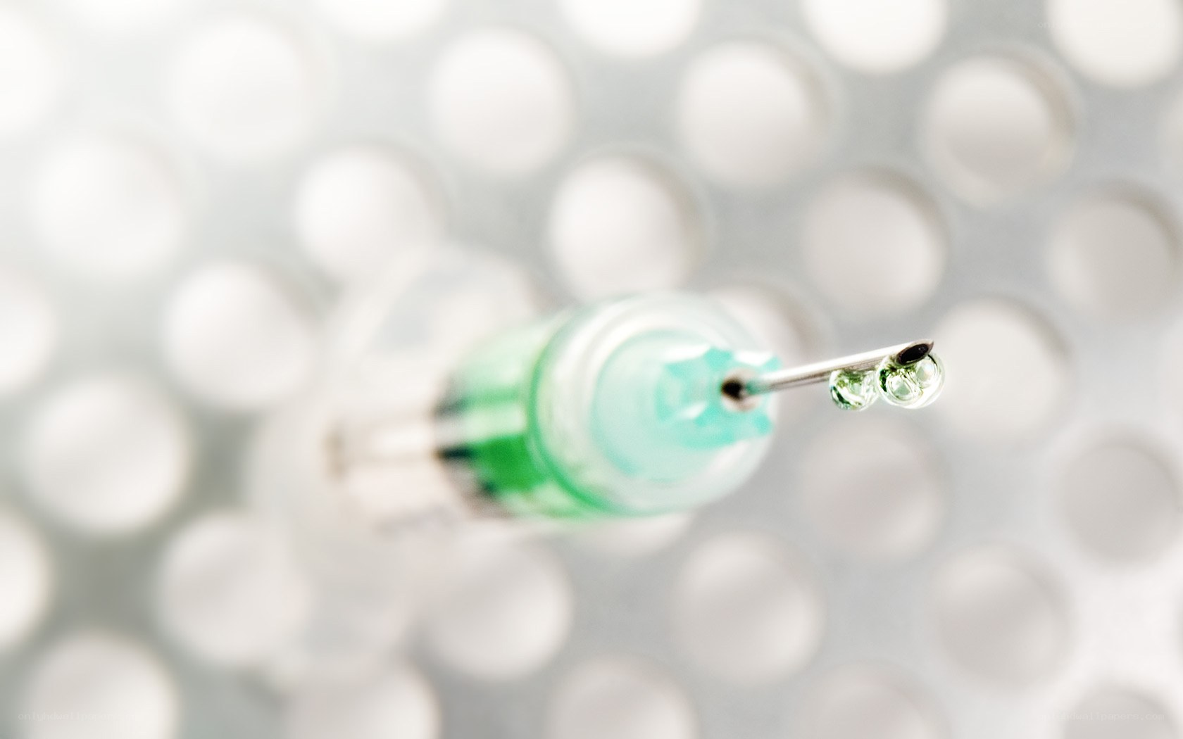 Syringe with green liquid