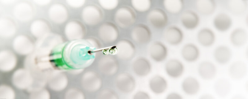 syringe with liquid drop