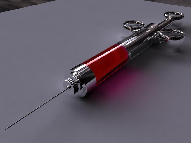 Syringe with red liquid