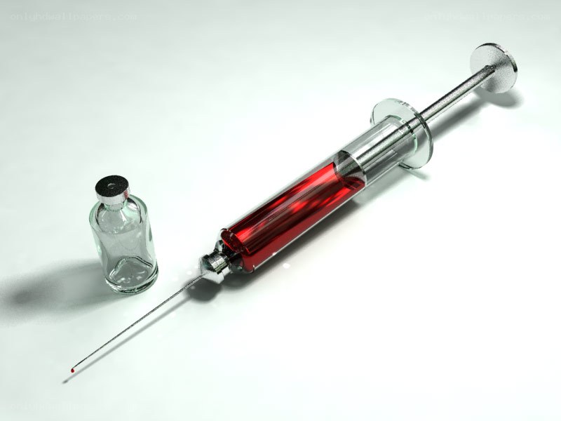 syringe with red liquid
