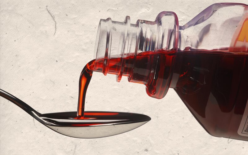 syrup being poured into spoon