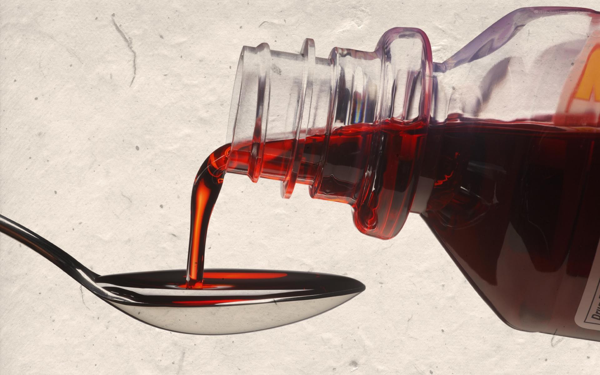 syrup being poured into spoon