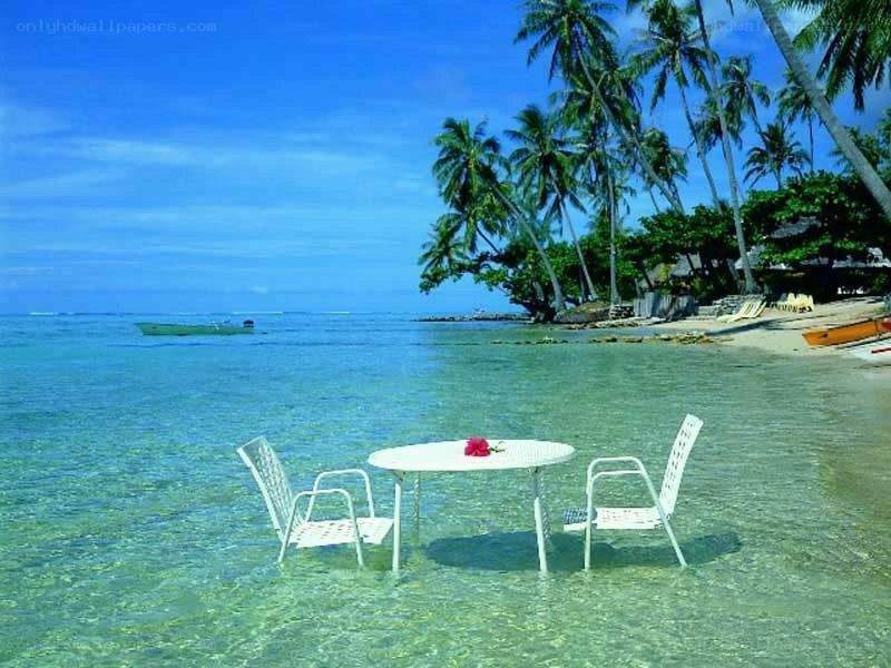 Table in tropical beach water