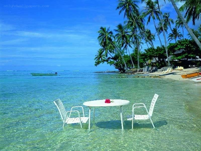 Table in tropical beach water