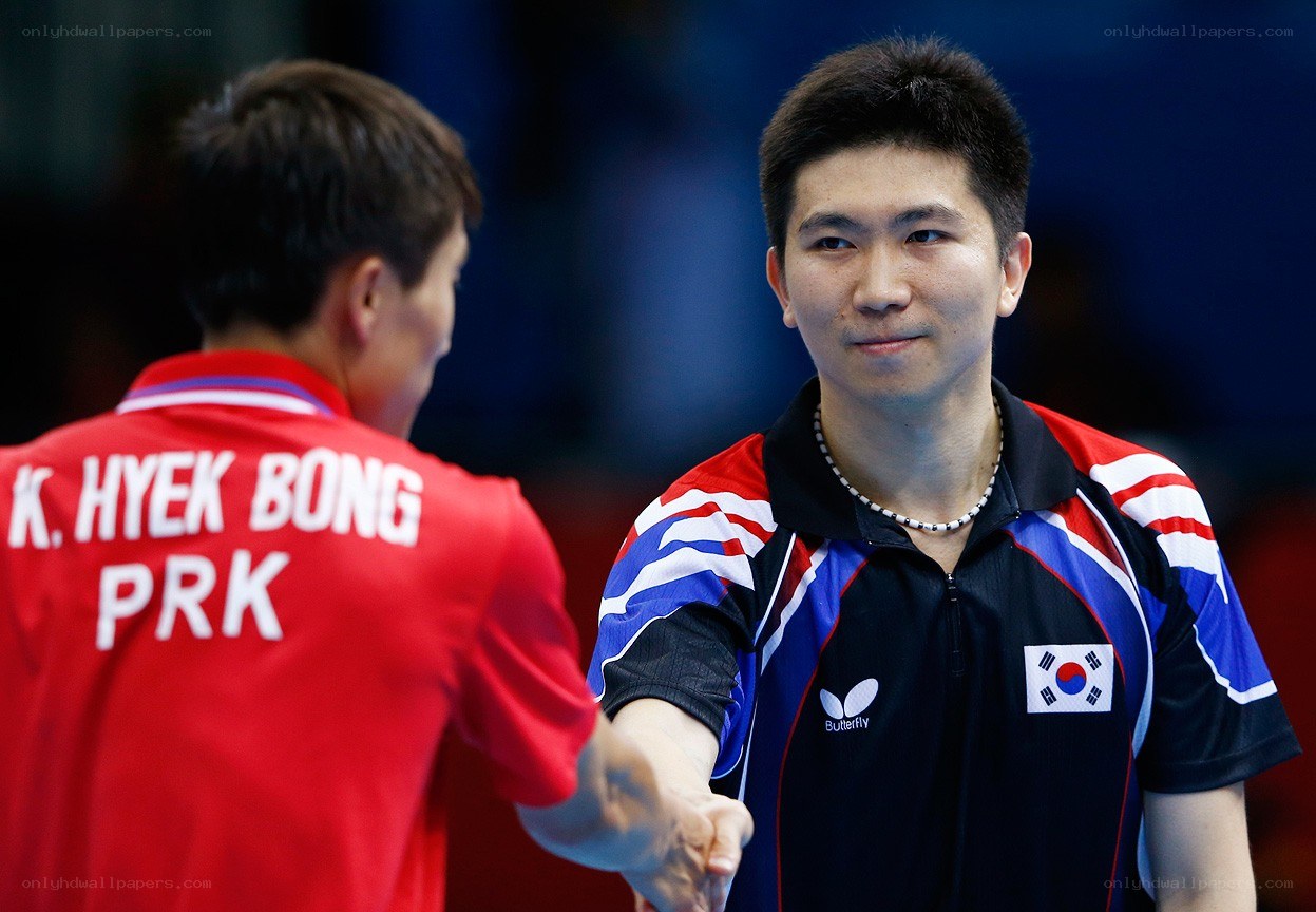 table tennis players shaking hands