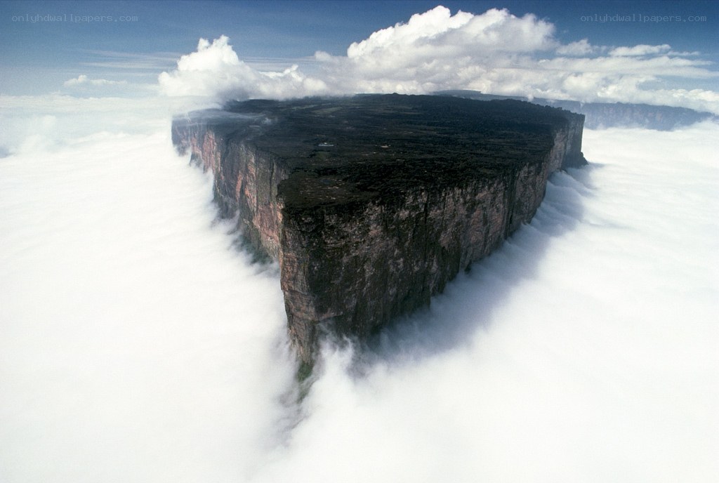 Table-top mountain above clouds