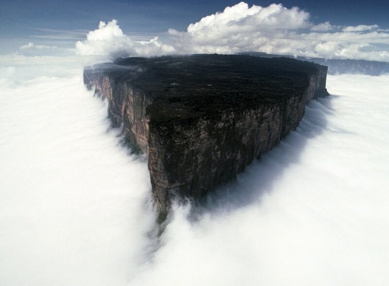 Table-top mountain above clouds