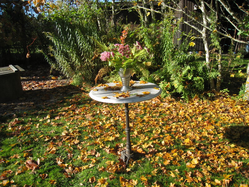 Table with Flowers in Garden