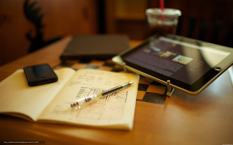 Tablet and Notebook on Table