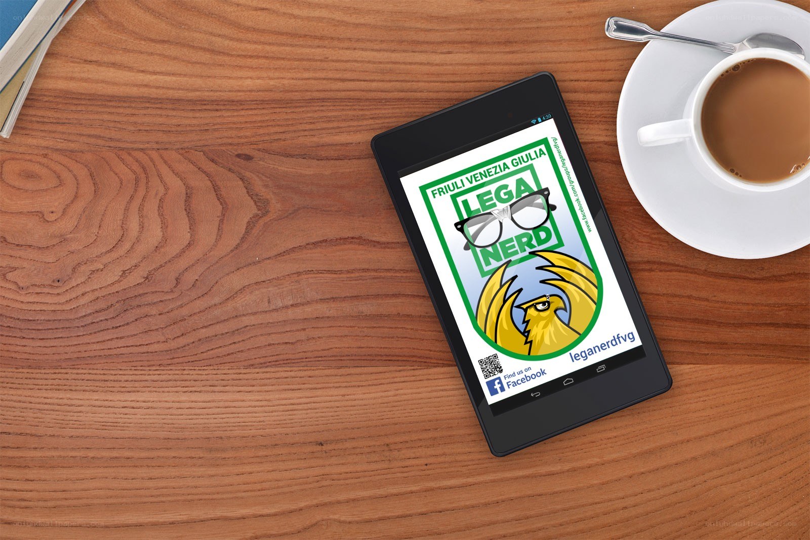 tablet displaying logo on wooden table