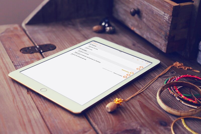 tablet on wooden table
