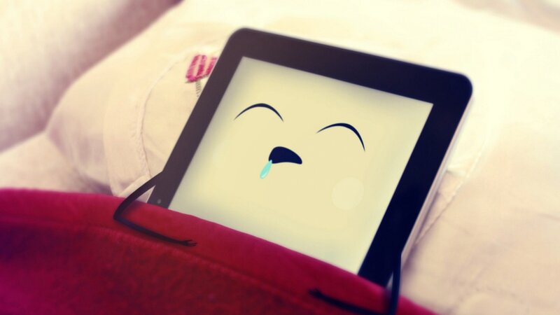 tablet with crying face