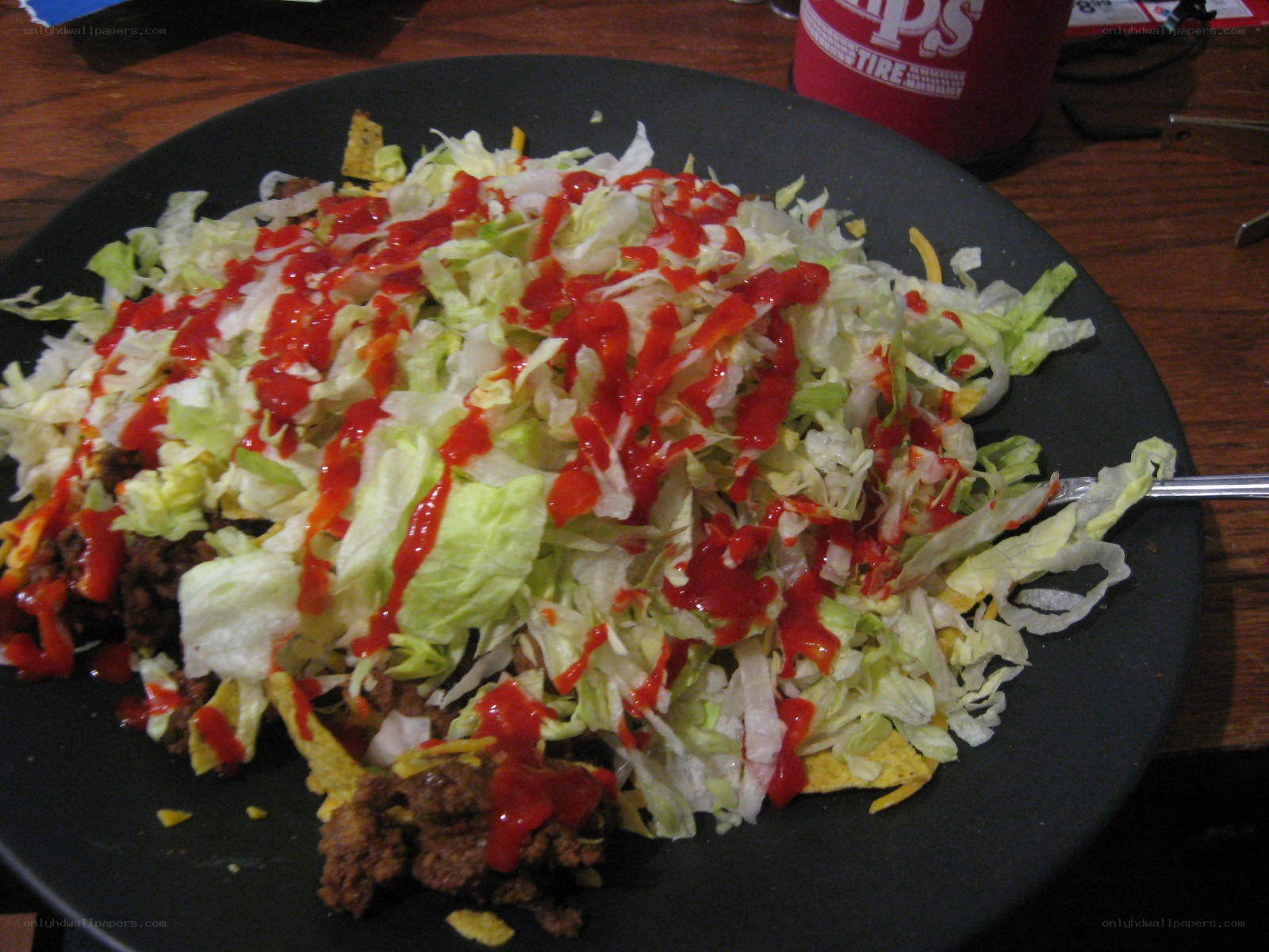 taco salad on a black plate