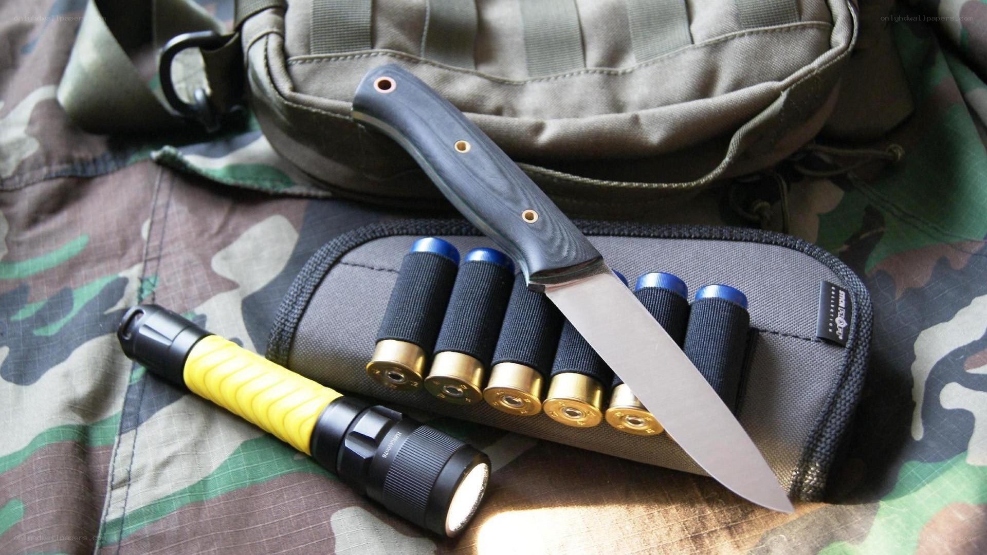 tactical gear with knife and flashlight