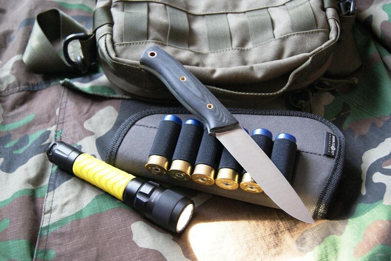 tactical gear with knife and flashlight