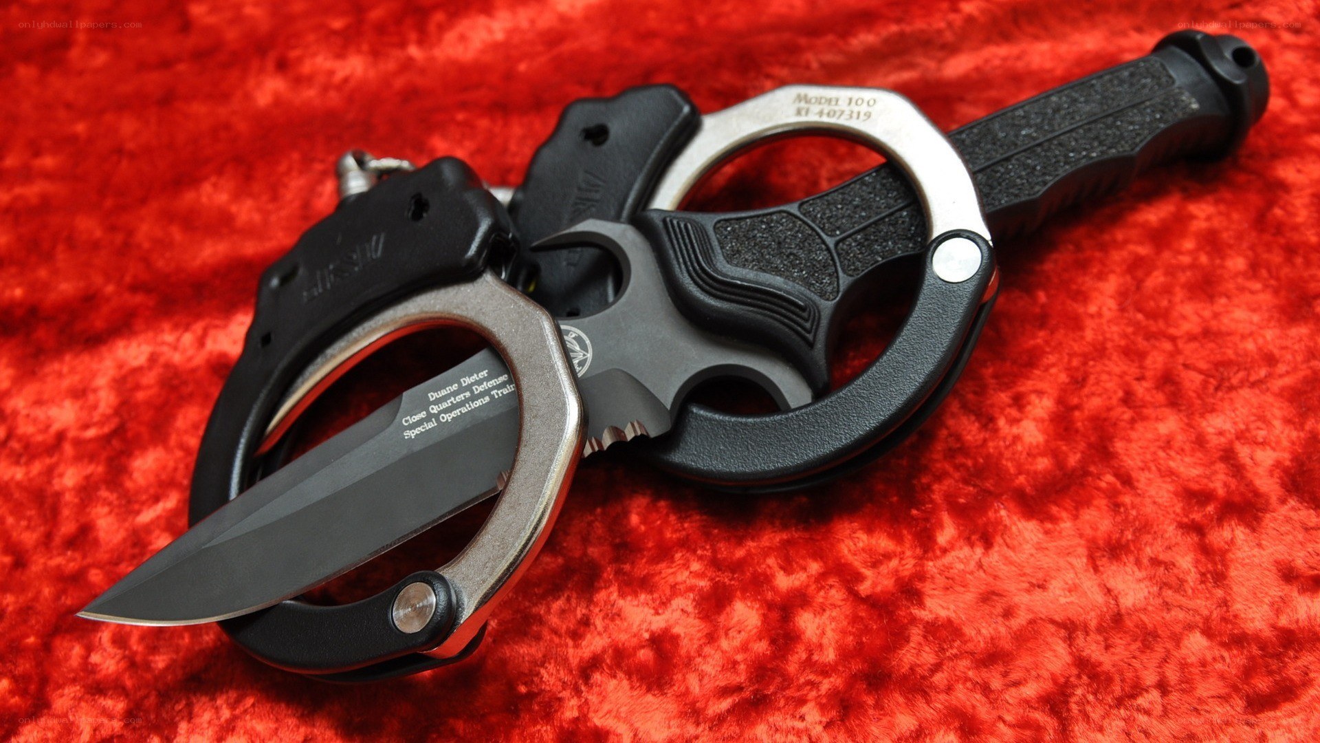 tactical knife and handcuffs
