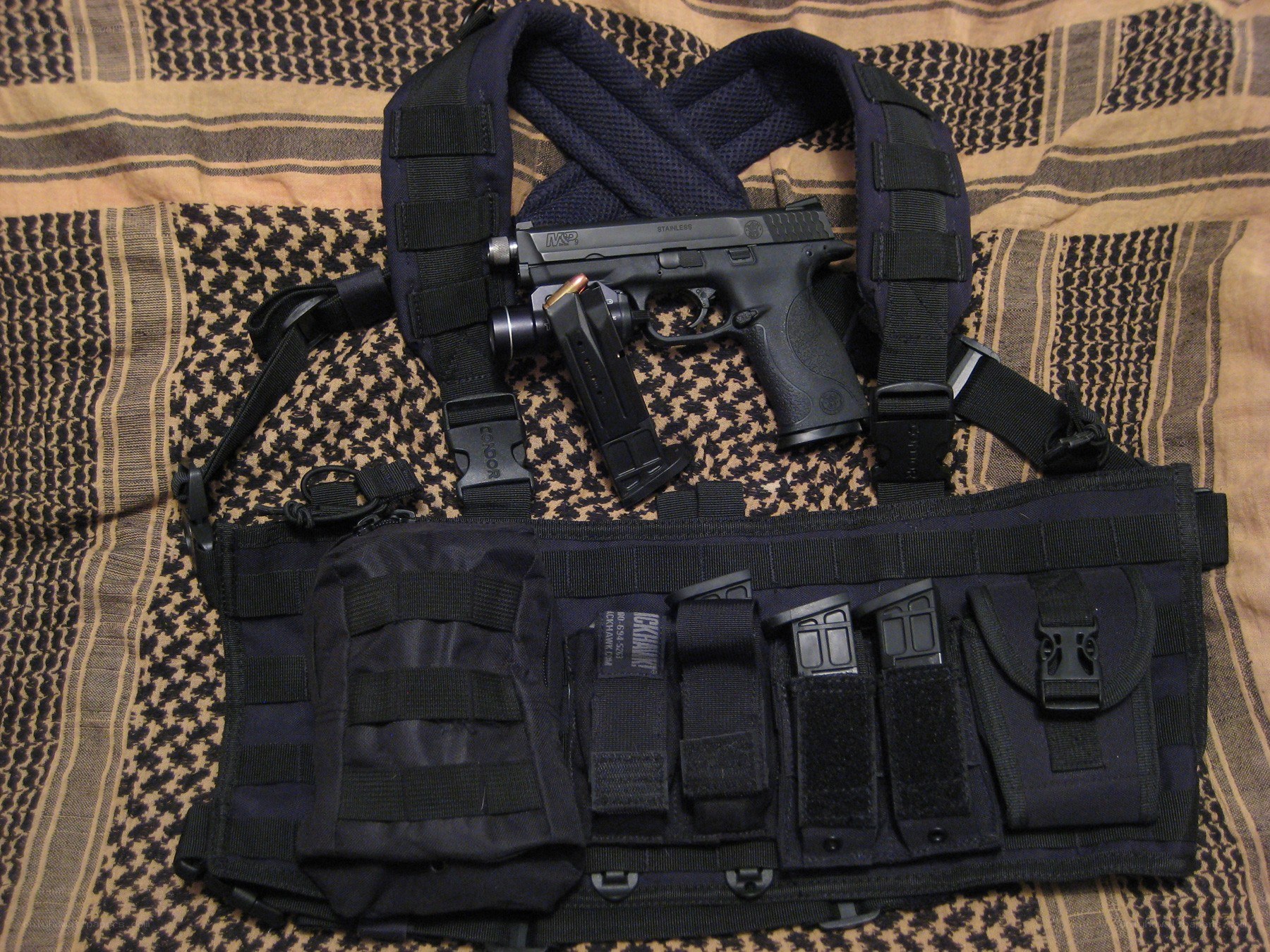 tactical vest with handgun