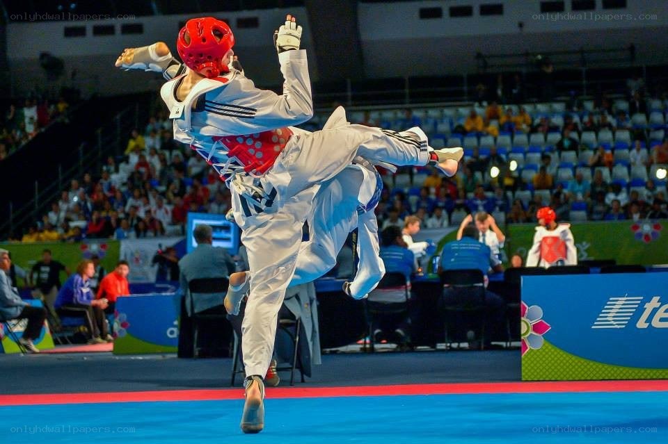 Taekwondo athlete executing high kick