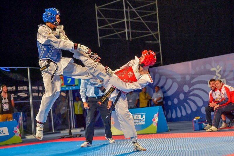 Taekwondo Athletes in Action — Blue, Intense, Night, Photograph, Helmet