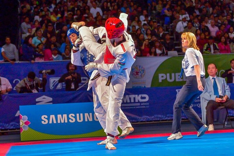 Taekwondo Athletes in Action — Blue, Intense, Photograph, Referee, Audience, Camera