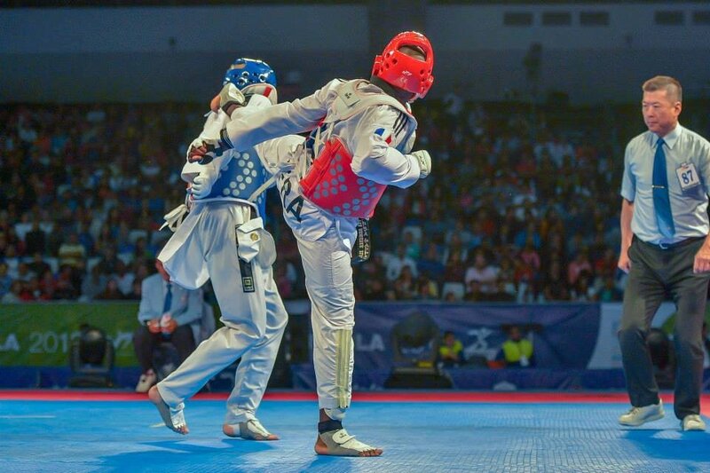 Taekwondo Competitors in Action — Blue