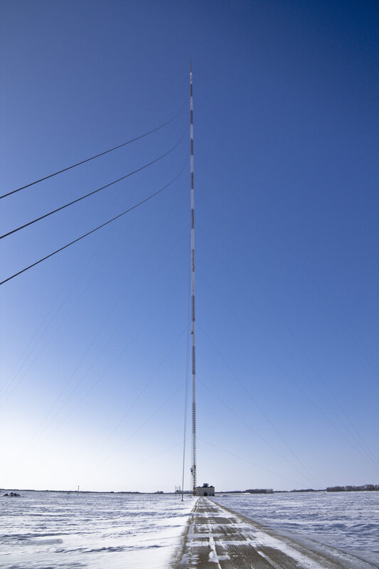 tall antenna in snowy field