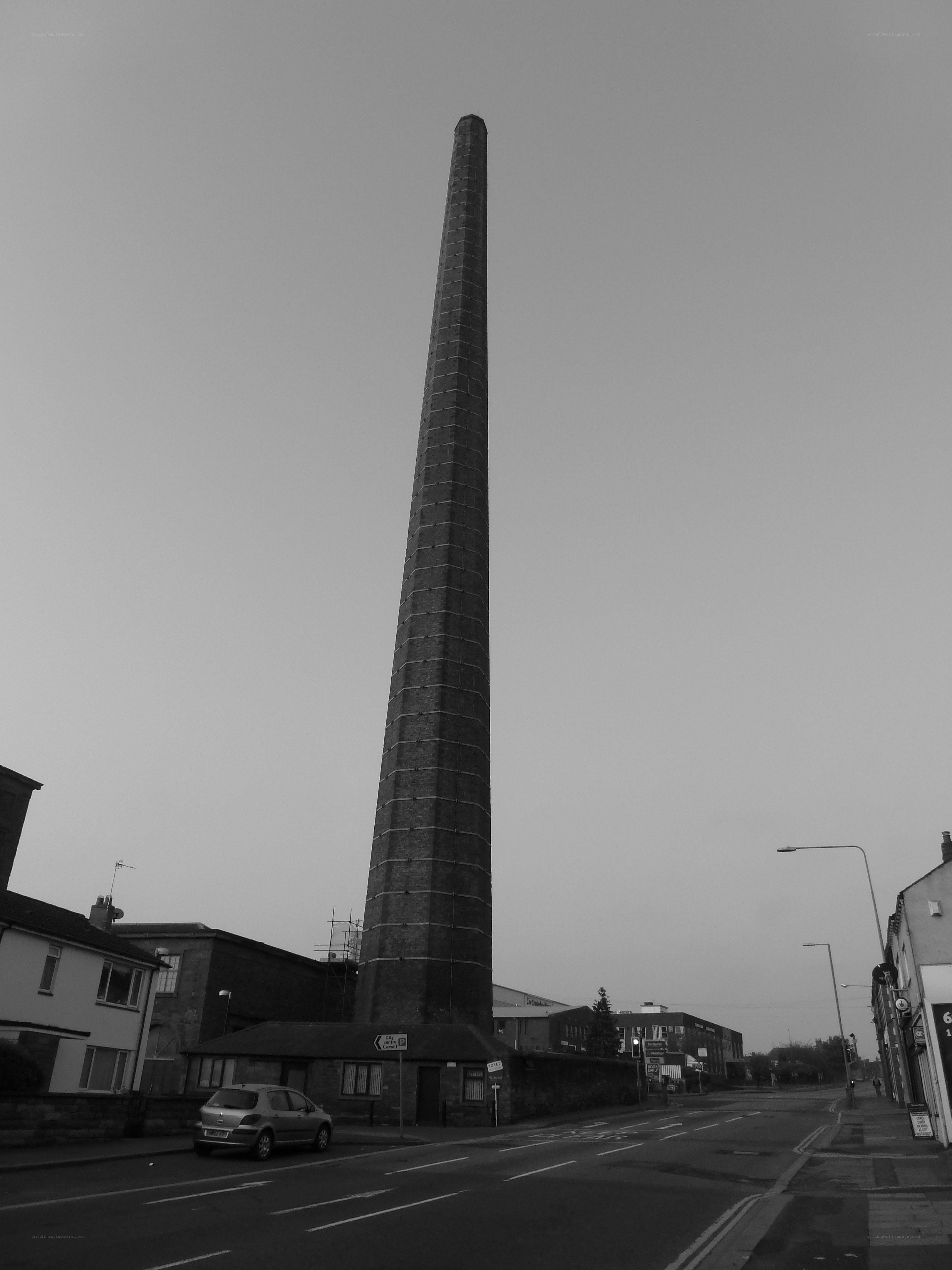 tall brick chimney on street