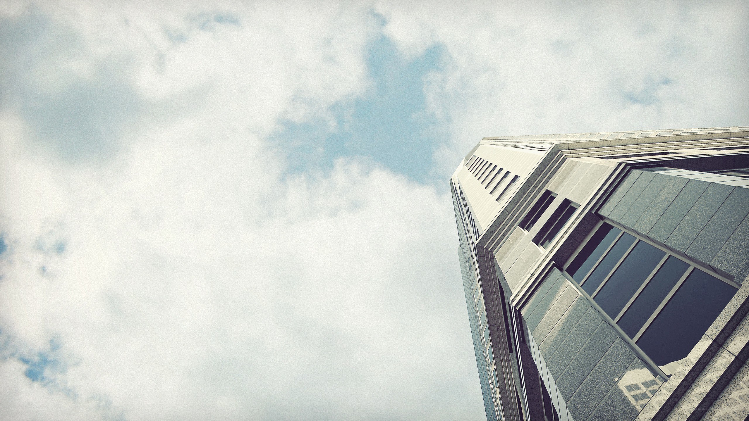 tall building against cloudy sky