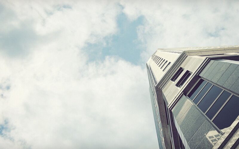 tall building against cloudy sky