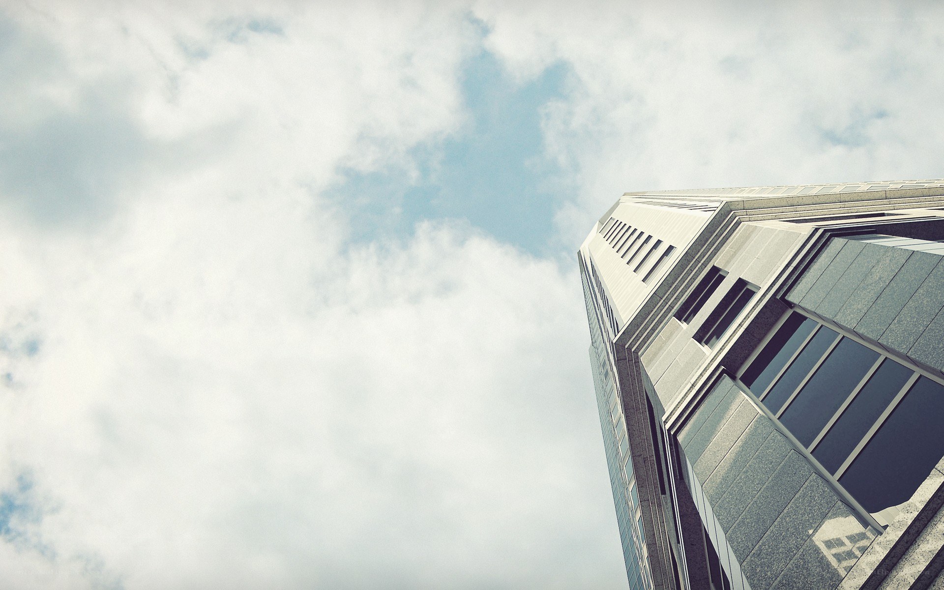 tall building against cloudy sky
