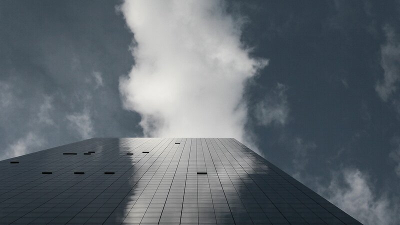 tall building against cloudy sky