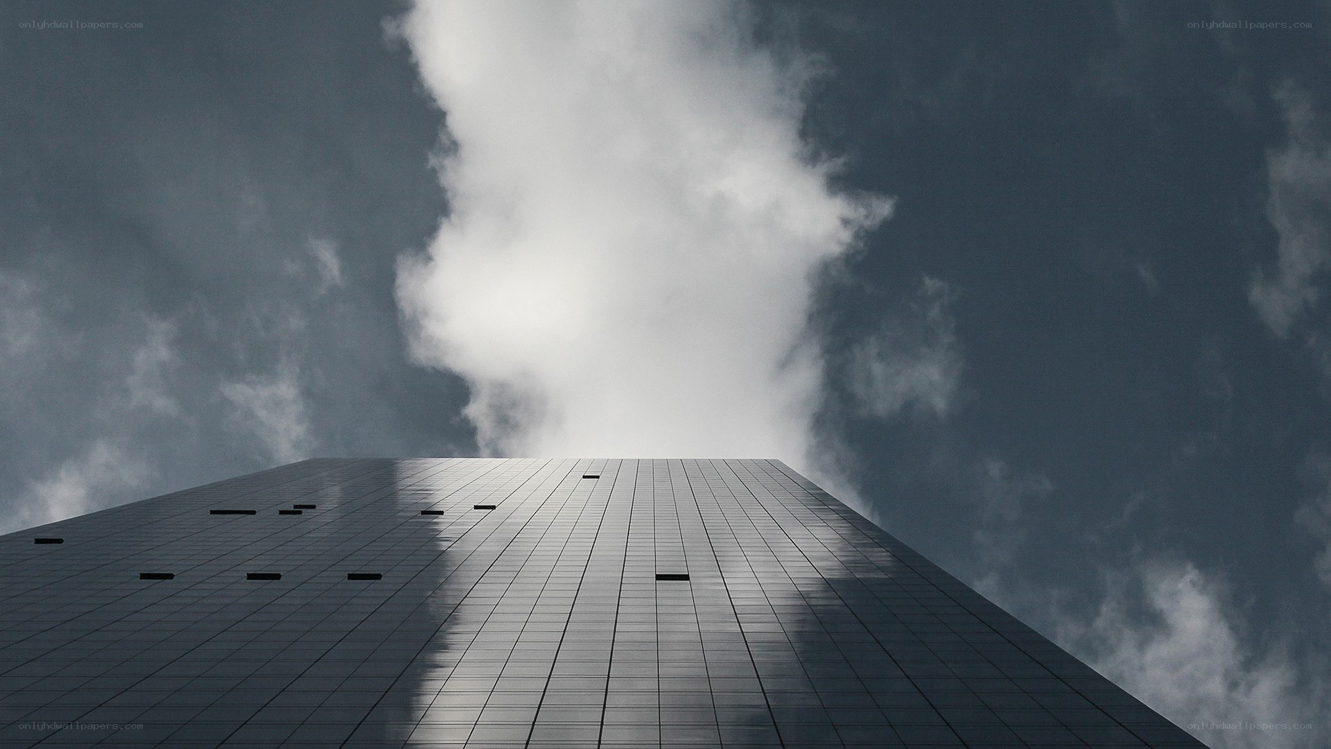 tall building against cloudy sky