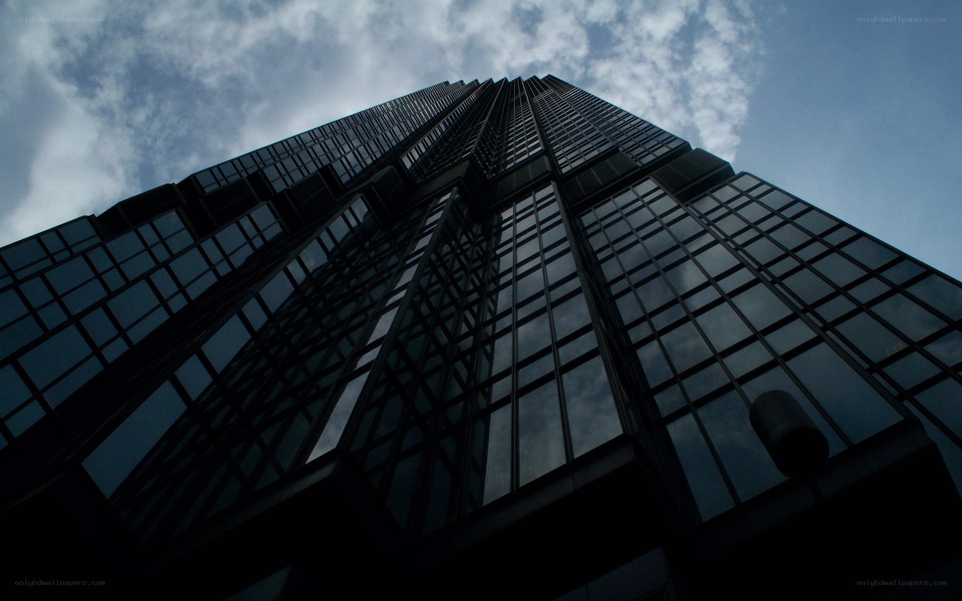 tall building against cloudy sky