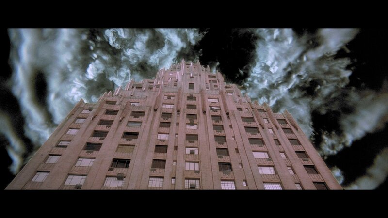Tall Building under Stormy Sky — Gray