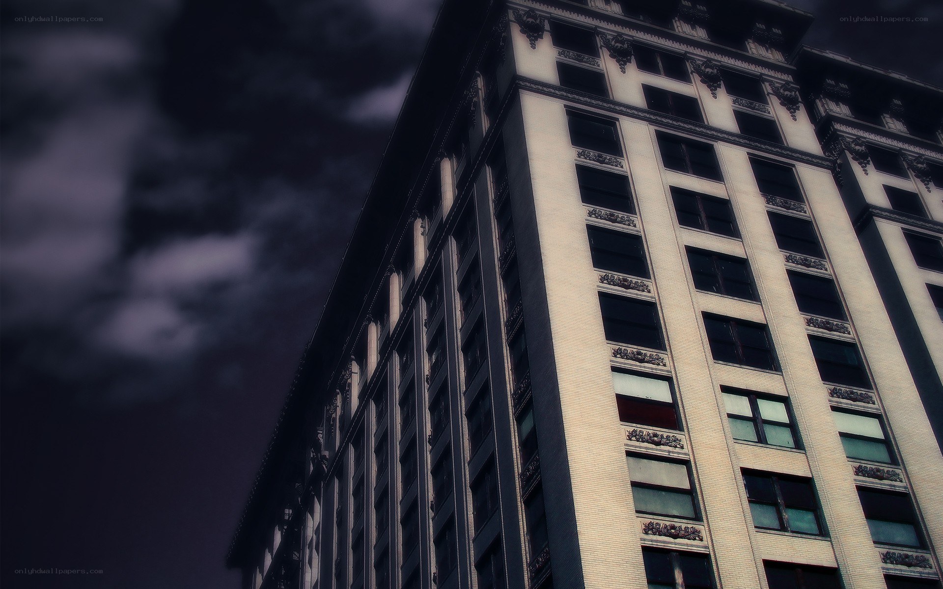 tall building under stormy sky