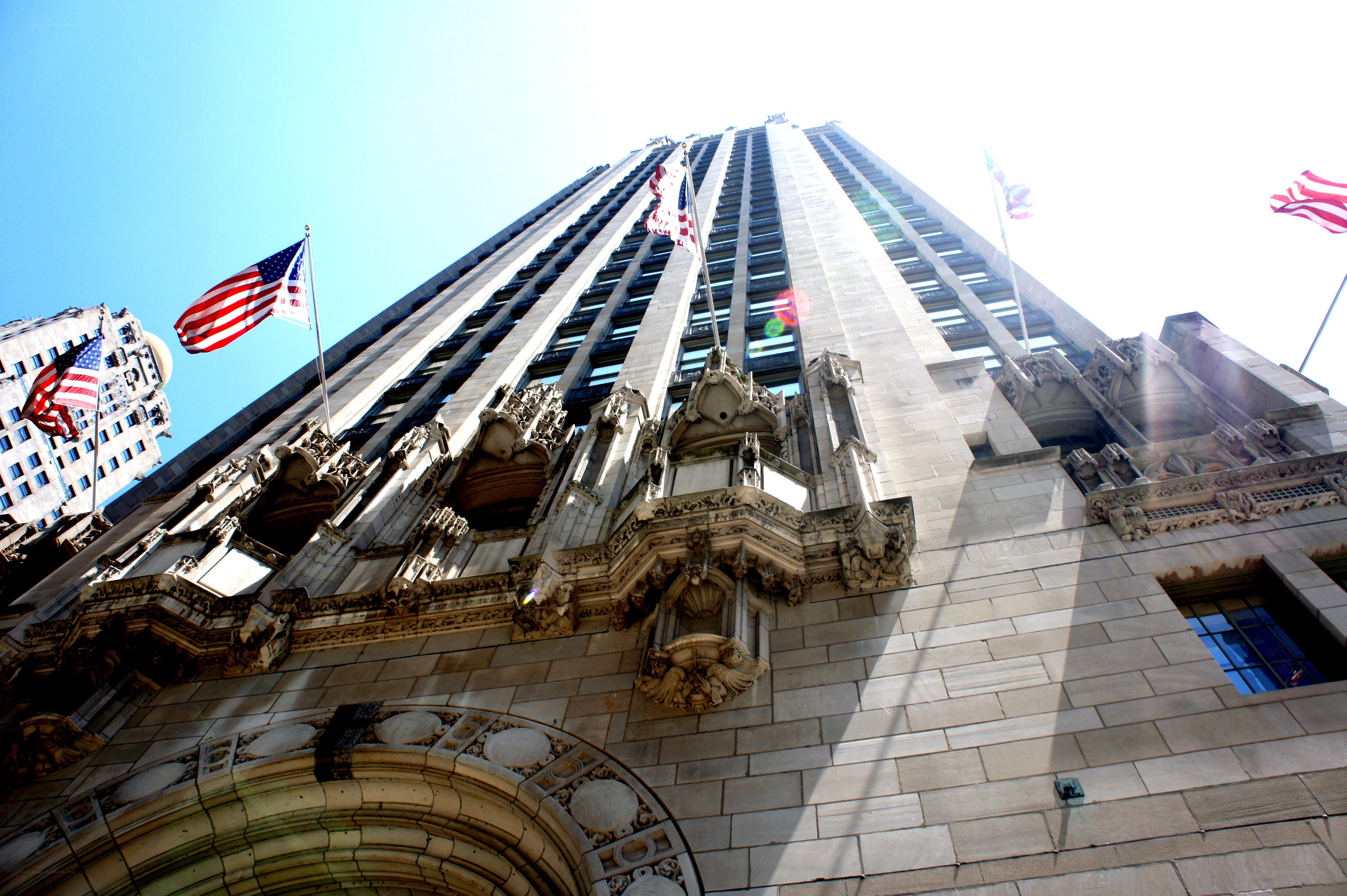 tall building with american flags