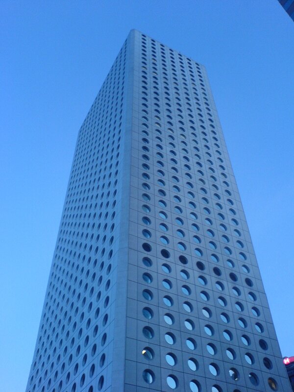 tall building with circular windows