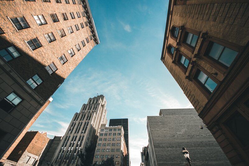 Tall Buildings in City — Blue, Dramatic, Afternoon, Photograph, Sky, Windows
