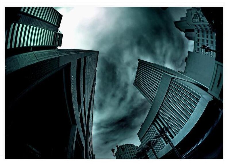 tall buildings under stormy sky